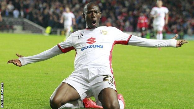 Benik Afobe helped to win promotion with MK Dons