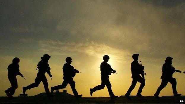 GB British Soldiers (in silhouette, silhouetted against sky) from 40 Regiment Highland Gunners in training at Shribah base 10 miles south of Basra, Iraq