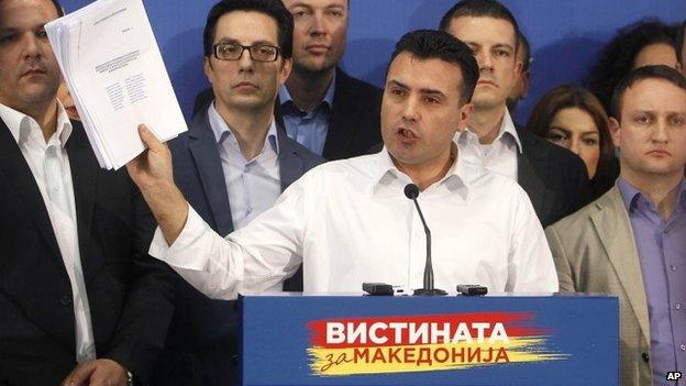 Zoran Zaev, the leader of the opposition Social-Democratic Alliance of Macedonia, shows lists of wire-tapped journalists during a news conference in the party headquarters in Skopje, Macedonia on 25 February 2015