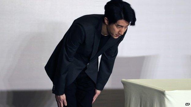 Hong Kong actor Jaycee Chan bows after a news conference at a hotel in Beijing Saturday, Feb. 14, 2015.