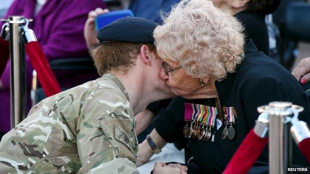 Prince Harry receives a kiss from Sydney resident Daphne Dunne at Sydney's Opera House on 7 May, 2015