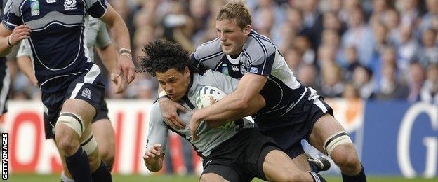 Scotland's John Barclay tackles Doug Howlett of New Zealand