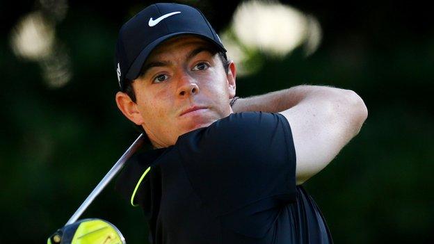 Rory McIlroy watches a tee shot in Thursday's first round at Sawgrass