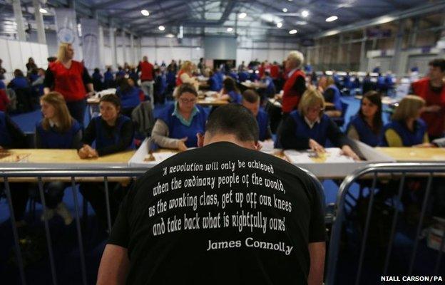 A Sinn Fein volunteer makes a tally as counting gets underway at the King's Hall in Belfast