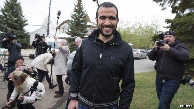 Omar Khadr leaves a news conference after being released on bail in Edmonton, Alberta, 7 May 2015.