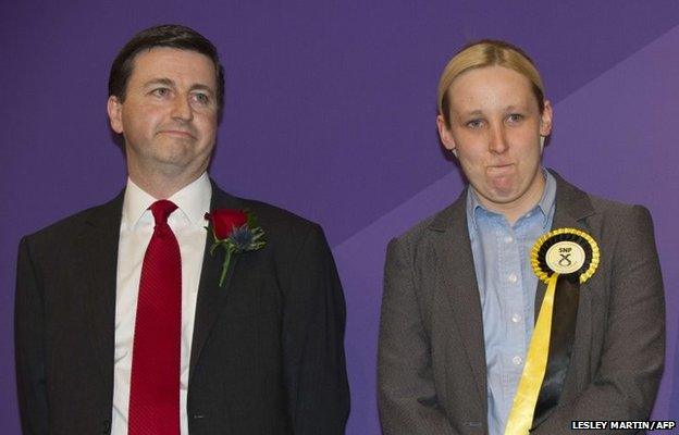 Newly-elected Scottish National Party (SNP) member of Parliament, Mhairi Black, Britain's youngest member of parliament since 1667, stands next to Labour candidate Douglas Alexander