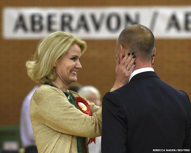 Danish Prime Minister Helle Thorning-Schmidt celebrates with her husband Stephen Kinnock as he is elected the Member of Parliament for the Aberavon Constituency