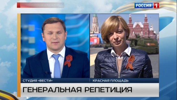 TV presenters wearing ribbons of St George