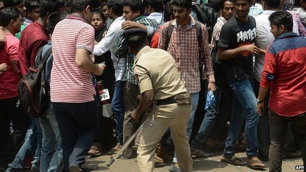 An Indian policeman tries to control fans outside Bollywood film actor Salman Khan"s house after his sentence in a hit-and-run case was suspended in Mumbai on May 8, 2015.