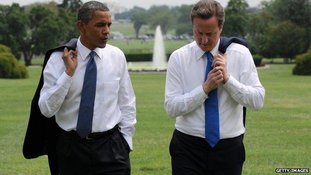 In this handout image supplied by The Prime Minister"s Office at 10 Downing Street, British Prime Minister David Cameron (R) and U.S. President Barack Obama talk in the grounds of the White House July 20, 2010 in Washington, DC