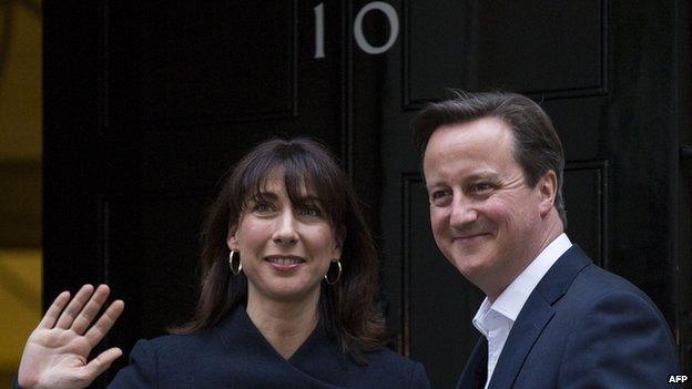 British Prime Minister David Cameron and his wife Samantha arrive at Number 10 Downing Street after election victory