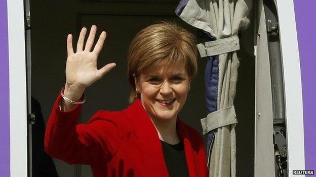 Nicola Sturgeon, leader of the Scottish National Party waves as she boards an aircraft bound for London, at Edinburgh Airport in Edinburgh, Scotland, Britain 8 May 2015