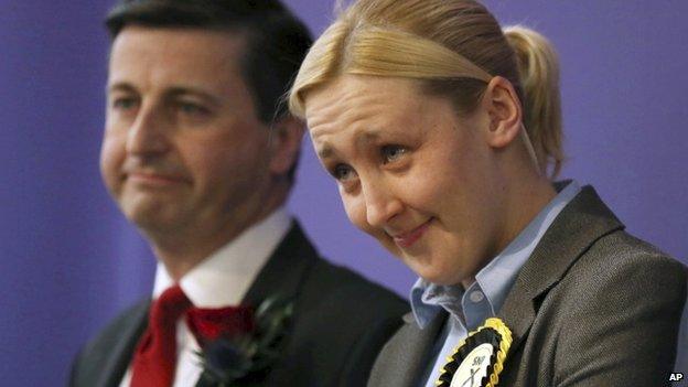 Paisley and Renfrewshire South constituency winner Mhairi Black of the Scottish National Party (SNP) and Labour's Douglas Alexander react at the Lagoon Leisure Centre in Paisley, Scotland Friday May 8, 2015.