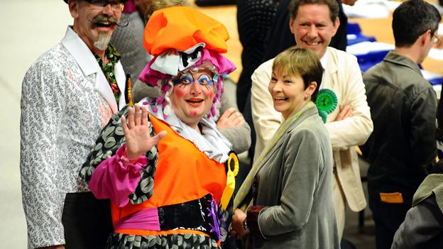 Caroline Lucas with a pantomime dame