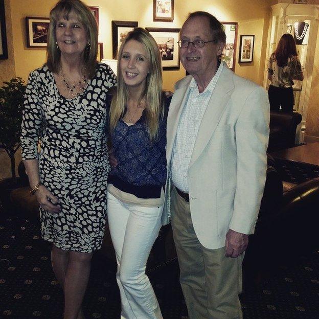 Marissa, centre, with her parents Rick and Mary