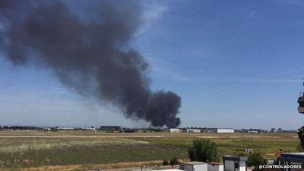 The remains of Airbus A400M are seen after crashing in a field near the Andalusian capital of Seville 9 May 2015.