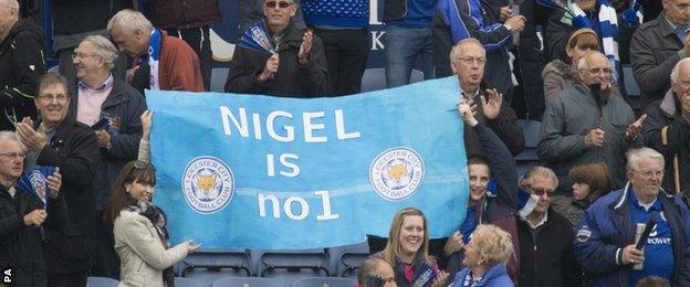 Leicester supporters hold up a banner praising manger Nigel Pearson