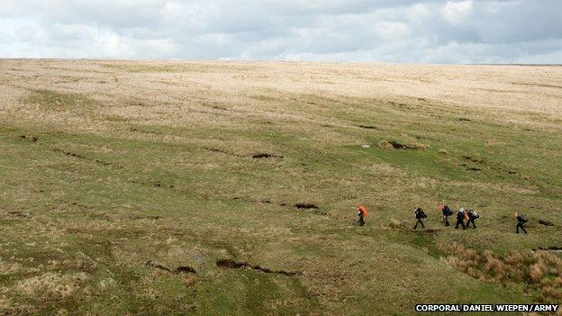 Team trekking across the moor