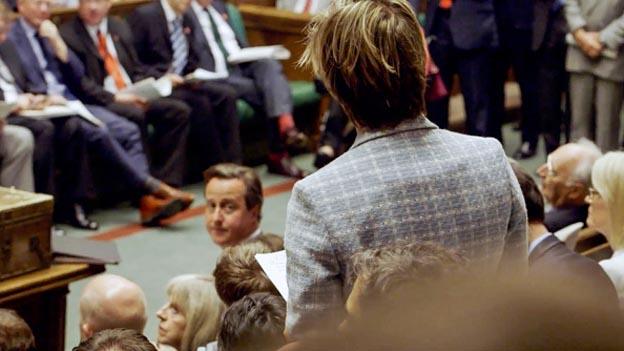 David Cameron looks towards a backbench MP in the Commons during the 2010-2015 Parliament