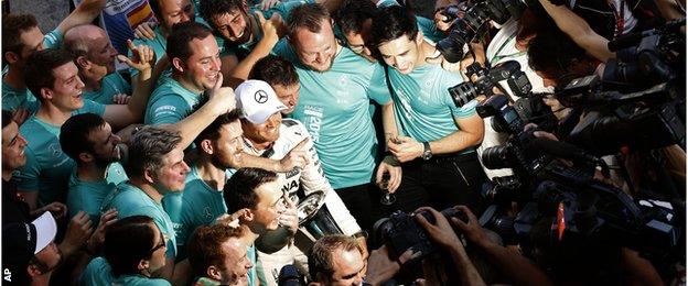 Nico Rosberg celebrates with his Mercedes team