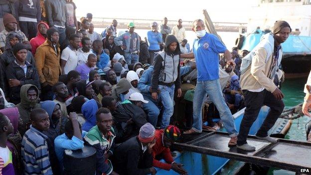 Migrants disembark from a boat after the Libyan coastguard intercepted a boat with African migrants trying to reach Europe at the port in the city of Misrata east of Tripoli, Libya, 03 May 2015