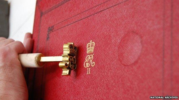 Royal cypher being embossed on the despatch box used by the Chancellor of the Exchequer