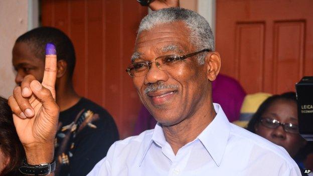 Presidential Candidate of the A Partnership for National Unity and Alliance For Change (APNU+AFC) David Granger displays his inked finger after voting at the Enterprise Primary School Georgetown Guyana, Monday, May 11, 2015