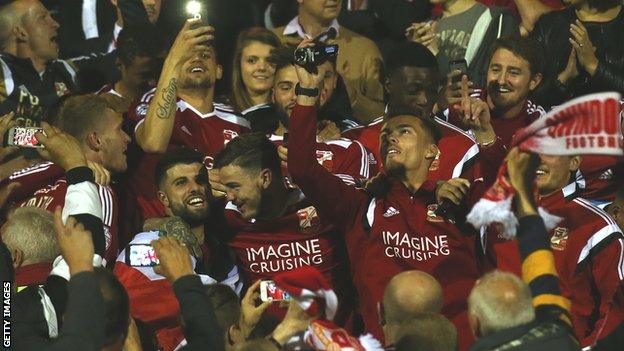 Swindon Town players celebrate