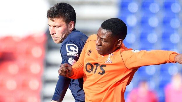 Ross County's Filip Kiss and Kilmarnock's Tope Obadeyi