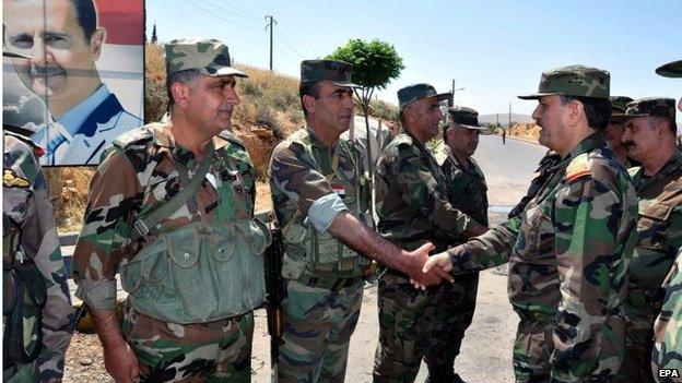 Syrian Defence Minister Fahd Jassem al-Freij (right) with troops near Damascus (06/05/15)