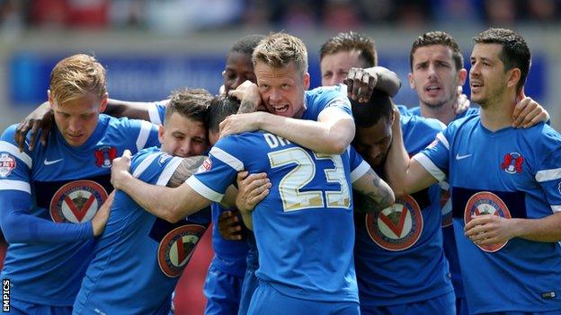 Leyton Orient's players celebrate Chris Dagnall's goal in their 2-2 at Swindon on the final day