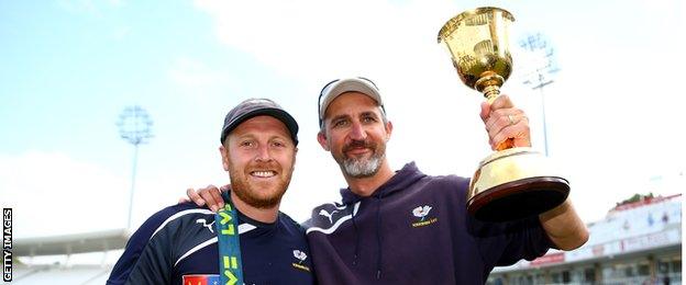 Former Australia bowler Jason Gillespie (right) celebrates County Championship success with Yorkshire's Andrew Gale