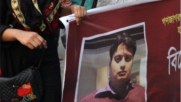 Poster of Bangladeshi blogger Ananta Bijoy Das held by activists protesting against his killing, in Dhaka, Bangladesh, 12 May 2015.