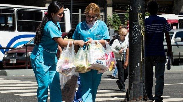 Women carrying shopping