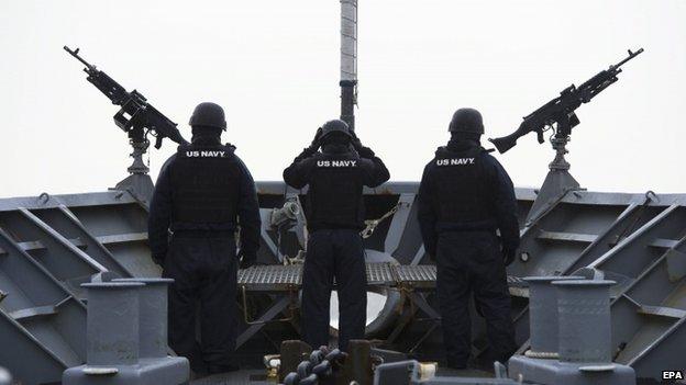 US Navy sailors monitor the area aboard US Navy's USS Vicksburg participating in NATO's Dynamic Mongoose anti-submarine exercise in the North Sea off the coast of Norway