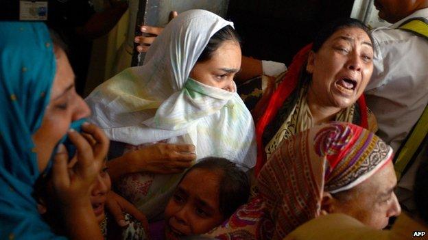 Pakistani relatives mourn after body of the convicted activist Saulat Ali Khan, also known as Saulat Mirza, arrives following his execution in Karachi on May 12, 2015