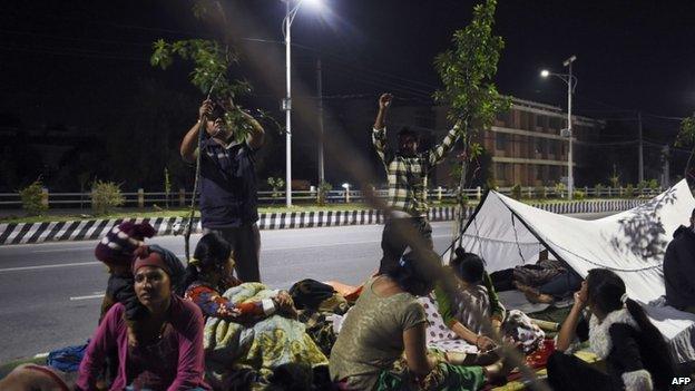 Kathmandu residents prepare for another night out in the open, 12 May