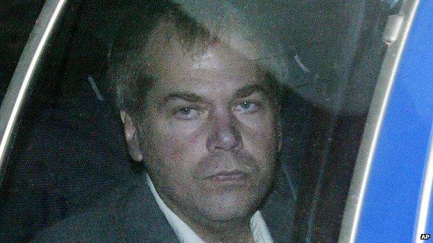 John Hinckley Jr, shown here in 2003, is inside of a car