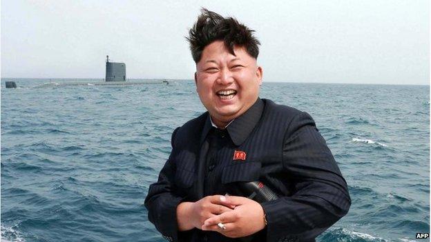 North Korea leader Kim Jong-un by a submarine at sea (9 May 2015)