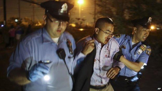 Police help an injured passenger. Photo: 12 May 2015