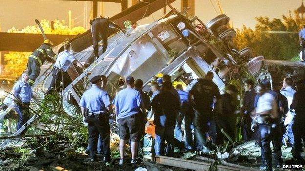 Rescue workers at the crash scene. Photo: 12 May 2015