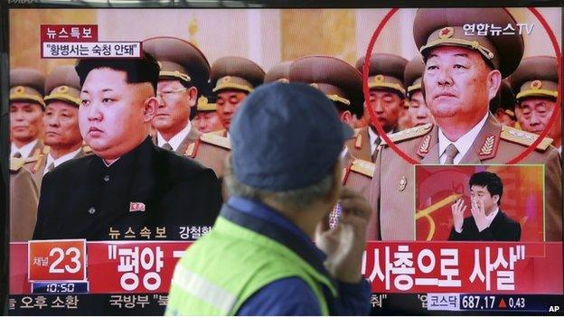 A man watches a TV news program reporting that People's Armed Forces Minister Hyon Yong-chol was killed by anti-aircraft gunfire, at Seoul Railway Station in Seoul, South Korea, Wednesday, 13 May 2015