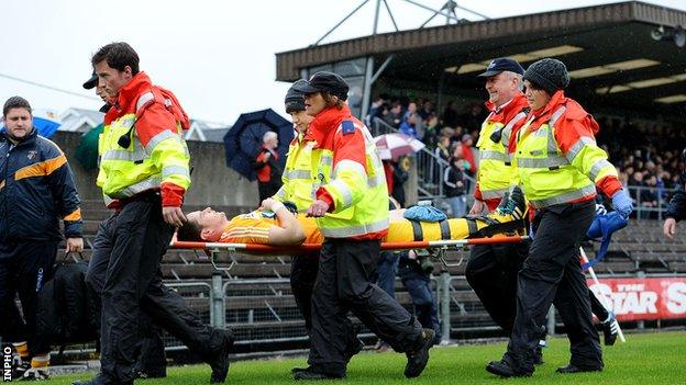 Aaron Graffin is stretchered off at Cusack Park