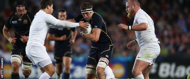 Richie Vernon hands-off Ben Coles as Scotland tackle England in the 2011 World Cup