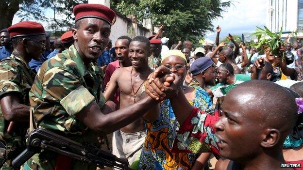 Protesters in Bujumbura celebrate the apparent dismissal of the president, 13 May