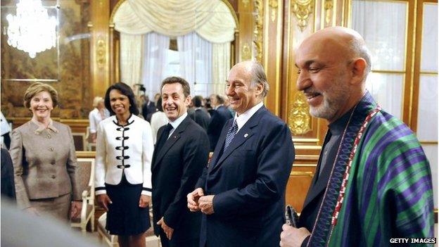 French President Nicolas Sarkozy (C) welcomes (LtoR) US First Lady Laura Bush, US Secretary of State Condoleeza Rice, Imam (spirtual leader) of the Shia Imami Ismaili Muslims, the Aga Khan, and Afghan President Hamid Karzai at the Kleber Center on June 12, 2008 in Paris.