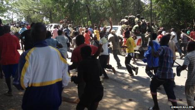 Thousands head towards the centre of Burundi's capital following a coup