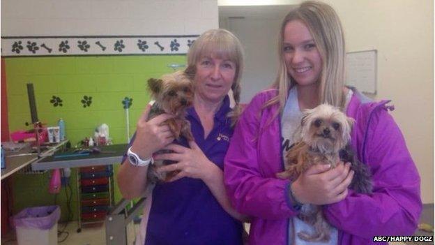 Happy Dogz staff pose with Boo and Pistol