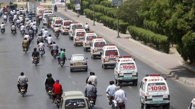 Ambulances carry the bodies of the victims of Wednesday's attack for burial