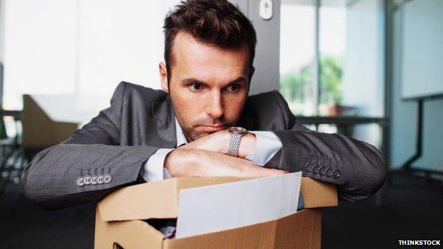 Man with box of work things